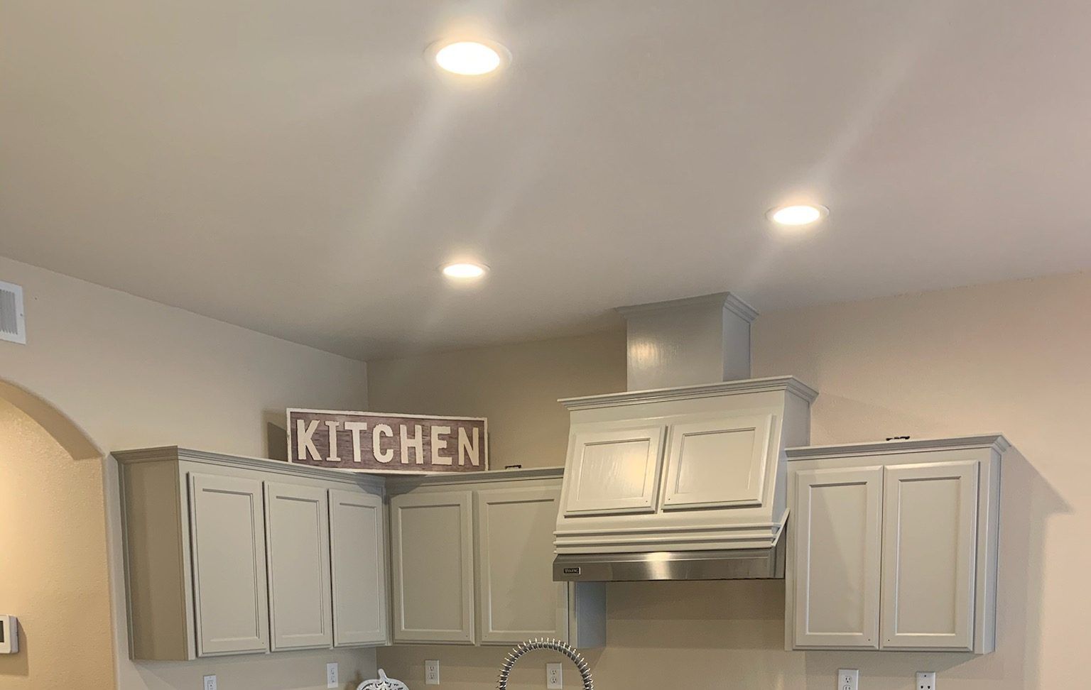 Kitchen with warm tan cabinets