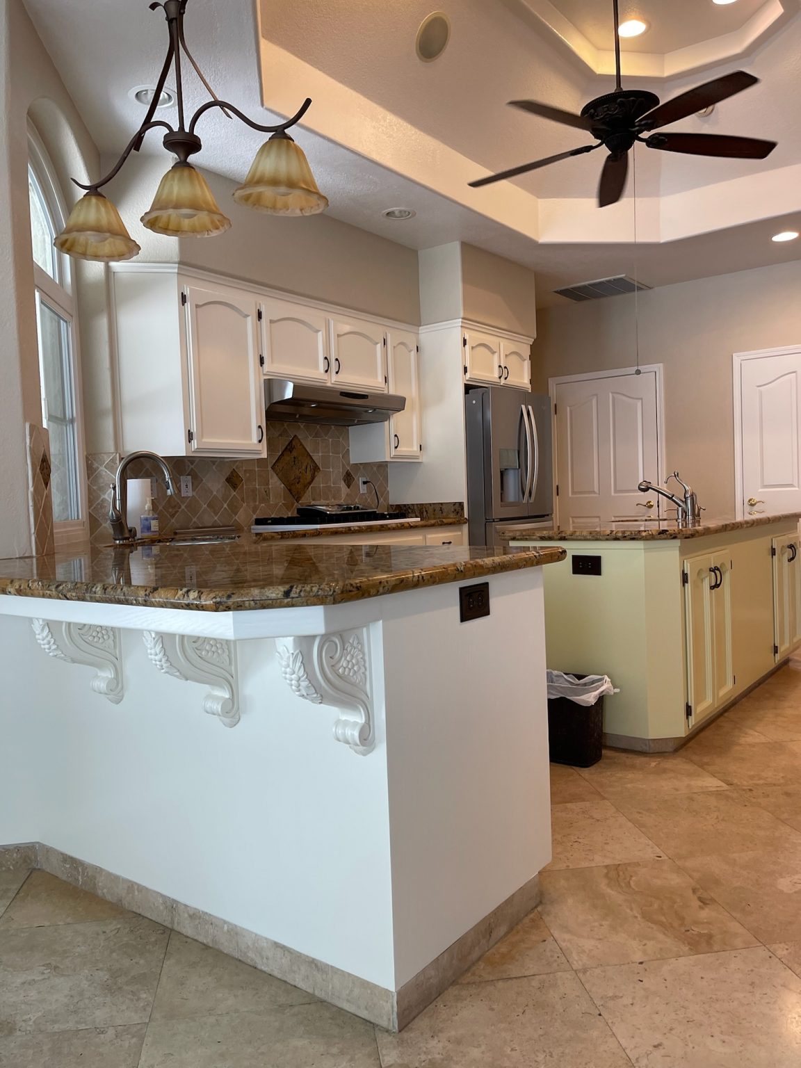 Kitchen cabinets and a painted island